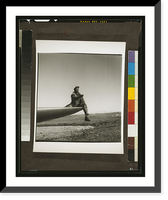 Black fighter pilot series: Ground crewman of the Red-Tailed Mustangs, 332nd Fighter Pilot Squadron, sitting on wing to direct pilot, Ramitelli, Italy, Antique Print