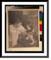 Historic Framed Print, [Beatrice Baxter Ruyl in white, with Ruth Ruyl in shorts on couch, reading book],  17-7/8" x 21-7/8"