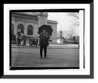 Unidentified man with umbrella standing in street with building in background, 12/15/2, Antique Print