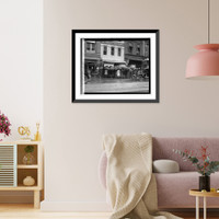 Rear view of group of women with umbrellas standing outside of store, Antique Print