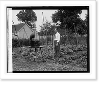Historic Framed Print, W.D. Terrell in garden with radio, [7/7/26],  17-7/8" x 21-7/8"