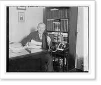 Historic Framed Print, [Unidentified man seated at desk with microphone],  17-7/8" x 21-7/8"