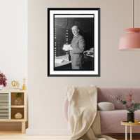 Historic Framed Print, Dr. J.W. Gidley of Smithsonian Institute with tooth of extinct elephant, 10/6/24,  17-7/8" x 21-7/8"