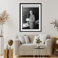 Historic Framed Print, Dr. J.W. Gidley of Smithsonian Institute with tooth of extinct elephant, 10/6/24,  17-7/8" x 21-7/8"