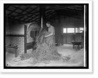 Man handling hay in industrial building, Vintage Poster