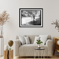 Historic Framed Print, [Woman with camera and man in woodland setting],  17-7/8" x 21-7/8"