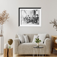 Historic Framed Print, M.J. Dady, Lou Payne, T.L. Woodruff, and G.W. Aldridge, seated together on porch,  17-7/8" x 21-7/8"