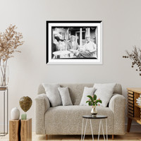 Historic Framed Print, Mrs. E. Wilkinson, C.G. Curtis, and Irving Chase, seated on porch,  17-7/8" x 21-7/8"