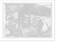 Historic Framed Print, Dr. W. Greene, at pilot wheel of aeroplane,  17-7/8" x 21-7/8"