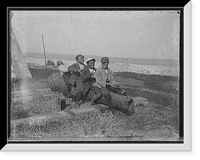Four black boys sitting on a cannon by a waterfront, Antique Wall Art