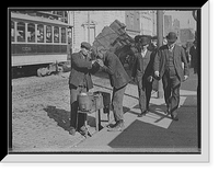 Historic Framed Print, [Man lighting cigarette for another on city street],  17-7/8" x 21-7/8"