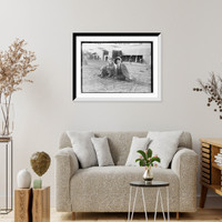 Historic Framed Print, Mrs. Payne Whitney with unidentified gentleman seated on flying field of aviation meet,  17-7/8" x 21-7/8"