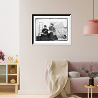 Historic Framed Print, Miss Sperder, seated with another lady, holding newspaper,  17-7/8" x 21-7/8"