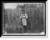 Historic Framed Print, [Boy in baseball uniform by fence],  17-7/8" x 21-7/8"