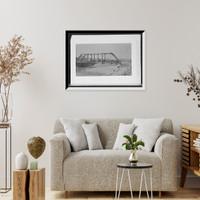 Carriage and wagon crossing bridge over river bluff, Antique Poster