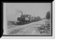 Locomotive pulling cars alongside road, possibly road construction in Michigan Classic, Antique Poster