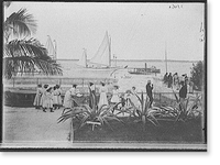 Girls watching boats at the wharf, possibly Nassau, probably Bahamas, Historic Reproduction