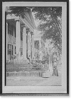 Mansion portico with costumed ladies, possibly a museum, Vintage Print