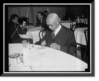 Vermont Senator, an ice cream fiend. Washington, D.C., Dec. 23. Senator Ernest W. Bigson, Republican of Vermont, tops off his luncheon with a plate of ice cream. It's his favorite sweet Heritage Wa