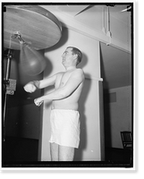 Rep. Albert Thomas of Tex. punching the bag at the House gym, Antique Poster