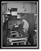 Testing airplanes lenses used in map making. Washington, D.C., May 6. Dr. F.E. Washer of the U.S. Bureau of Standards testing the lens for the airplane cameras that are used by the Army and Navy. V