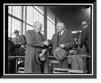 Senator Joseph F. Guffey, of Penna., right with CY Cummings, a member of the Curtis Walker Democratic Club, and well known in Maryland's racing circles, snap as they greated each other at the Bowie