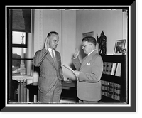 Old swears in the new. Washington, D.C., Aug. 9. C.E. Maceachran, (right) retiring Chief Clerk of the State Department, administering the oath of office to his successor, Edward Yardley. Timeless W