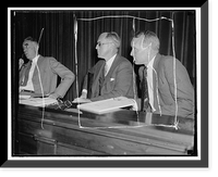 Listen to maritime troubles. Washington, D.C. Aug. 23. Chairman Joseph P. Kennedy, (left) and Commissioner Emory S. Land listen intently as maritime labor chiefs testify at the initial hearing of t
