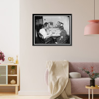 Historic Framed Print, First family to settle in Greenbelt. Washington, D.C. The first family to move in and get settled in Greenbelt, MD, the, Resettlement Administration city, is Mr. and Mrs. J.M.,  17-7/8" x 21-7/8"