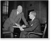 Historic Framed Print, Auto magnates appear before Monopoly Committee. Washington, D.C., Dec. 6. Into a huddle went Paul G. Hoffman, right, President of the Studebaker Corporation and H.C.,  17-7/8" x 21-7/8"