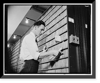 Patent Office employee pointing to copies of first patent granted after 1836 when patent laws were rewritten, Antique Wall Art