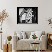 Patent Office employee pointing to copies of first patent granted after 1836 when patent laws were rewritten, Antique Wall Art