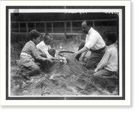 Historic Framed Print, Theo Roosevelt's children burying a dog in the sand,  17-7/8" x 21-7/8"