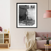 Baby on large unicycle held up by ropes, Antique Poster