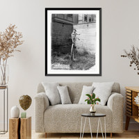 Baby on large unicycle held up by ropes, Antique Poster