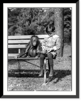 Boy seated with orangutan on bench at the National Zoo, Washington, D.C, Historic Reproduction
