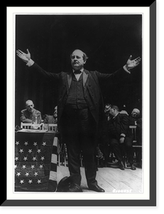William Jennings Bryan, full-length view with arms spread, standing next to flag drapped table on stage; men seated in the background, during 1908 Democratic National Convention Classic Wall Art