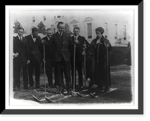 President & Mrs. Coolidge on skis on the White House lawn during visit of members of the National Ski Assn., Dec. 18, 1924, Antique Print