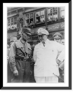 Hermann Goering, three-quarter length, standing, wearing Luftwaffe uniform, talking with unidentified man in SA uniform on the street in Dinkelsb&uuml;hl, Germany, Vintage Print
