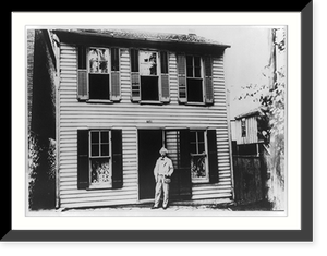 Mark Twain standing in doorway of his boyhood home on Hill Street, Hannibal, Missouri, Historic Reproduction