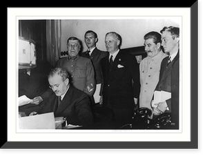 Molotov signing Russo-German pact in Moskov; Stalin, Ribbentrop and others look on, Vintage Print
