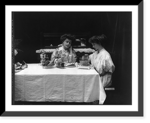 2 women using G.E. appliances: toaster, coffeepot and egg poacher, Historic Print