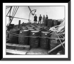 Historic Framed Print, [Coast Guard Cutter, USS Seneca chasing and capturing a rum runner" 1924: Prohibition agents examining barrels on boat]",  17-7/8" x 21-7/8"