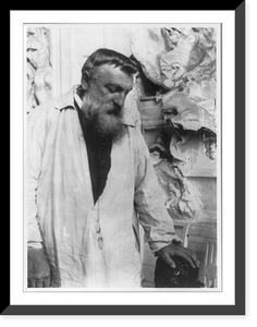 Auguste Rodin, 1840-1917, three quarters length portrait, face looking down, facing right, hand on sculpture. Taken in Meudon, France, about 1906, Vintage Wall Art