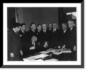 Historic Framed Print, [Vice President John N. Garner, seated at desk, greeting the 9 new senators],  17-7/8" x 21-7/8"