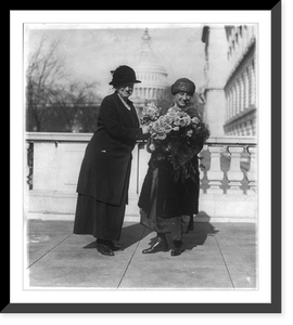 Miss Alice Robertson of Okla. presenting her new collegue sic, Mrs. Winifred Mason Huck with flowers on the latter's arrival at the House Office Building, Antique Print