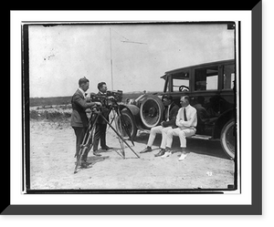 Jack Dempsey at his training camp, June 1921: sitting on auto with man; being filmed Classic, Vintage Wall Art