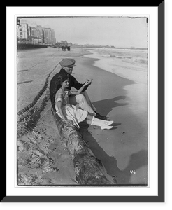Jack Dempsey at his training camp, June 1921: sitting on beach with daughter, Vintage Print