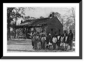 African American students and adults, possibly teachers, standing outside a school house, Historic Reproduction