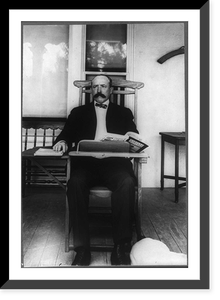 Alton Brooks Parker, 1852-1926, full length portrait, seated, facing slightly left; in classroom desk chair reading Harper's Magazine, Vintage Poster
